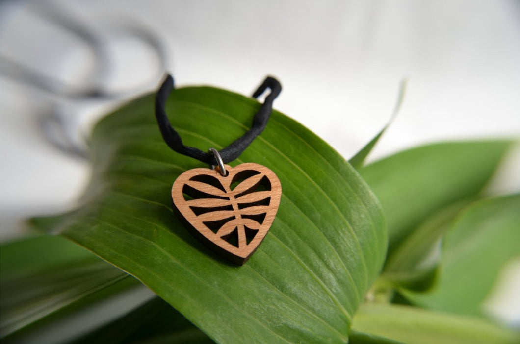 Tiny Heart Pendant in cherry on leather cord